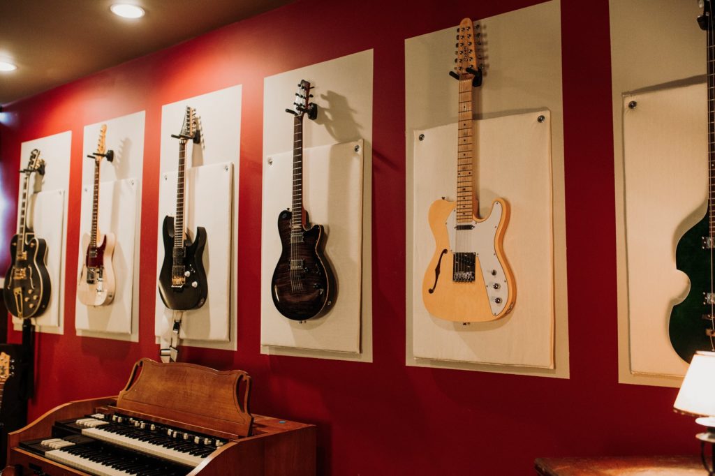 Guitars hung on a wall at F5 SoundHouse